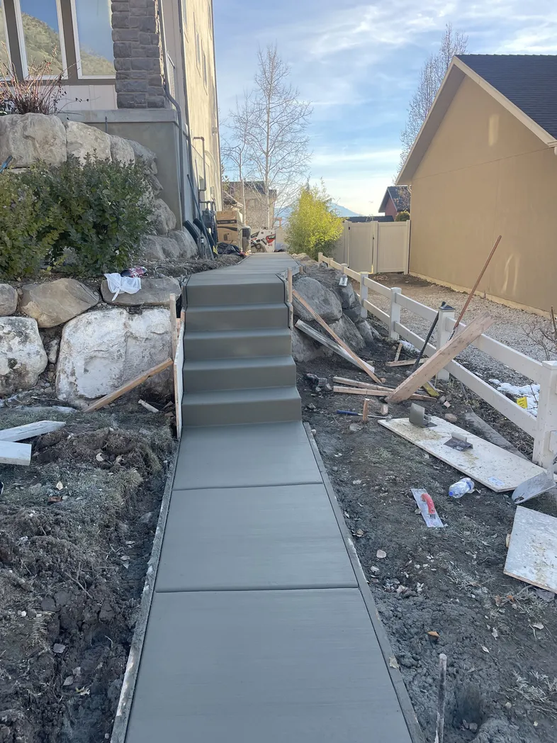 Outdoor concrete walkway with edge detailing and finish planning