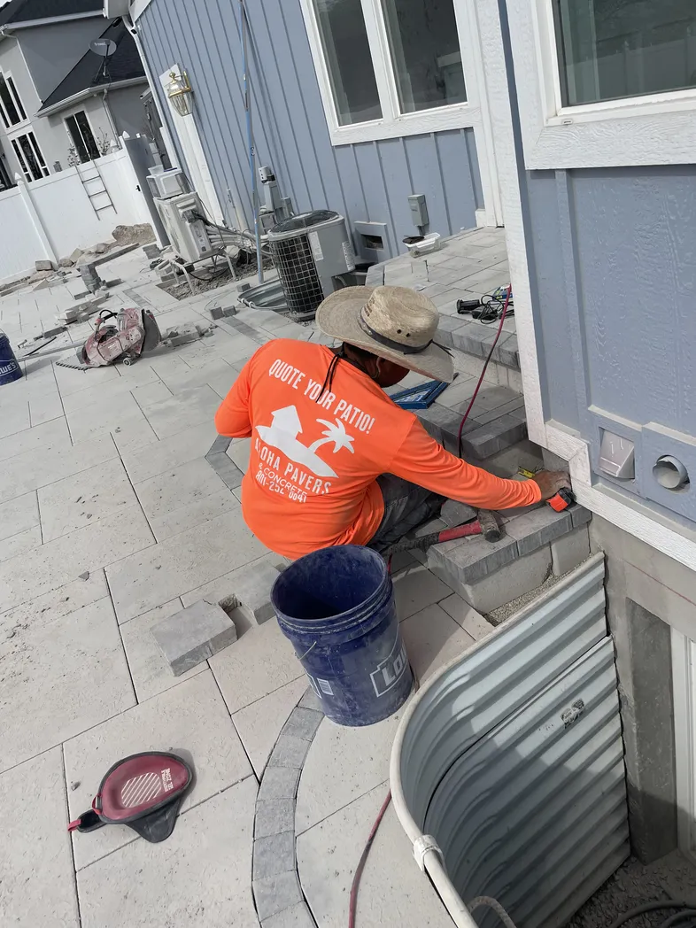 Aloha Pavers & Concrete crew installing patio pavers